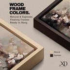 An abstract framed canvas artwork depicting cherry blossom flowers in soft, blurred tones with textured brush strokes creating a delicate floral composition that evokes the beauty of spring blooms in a modern artistic style.