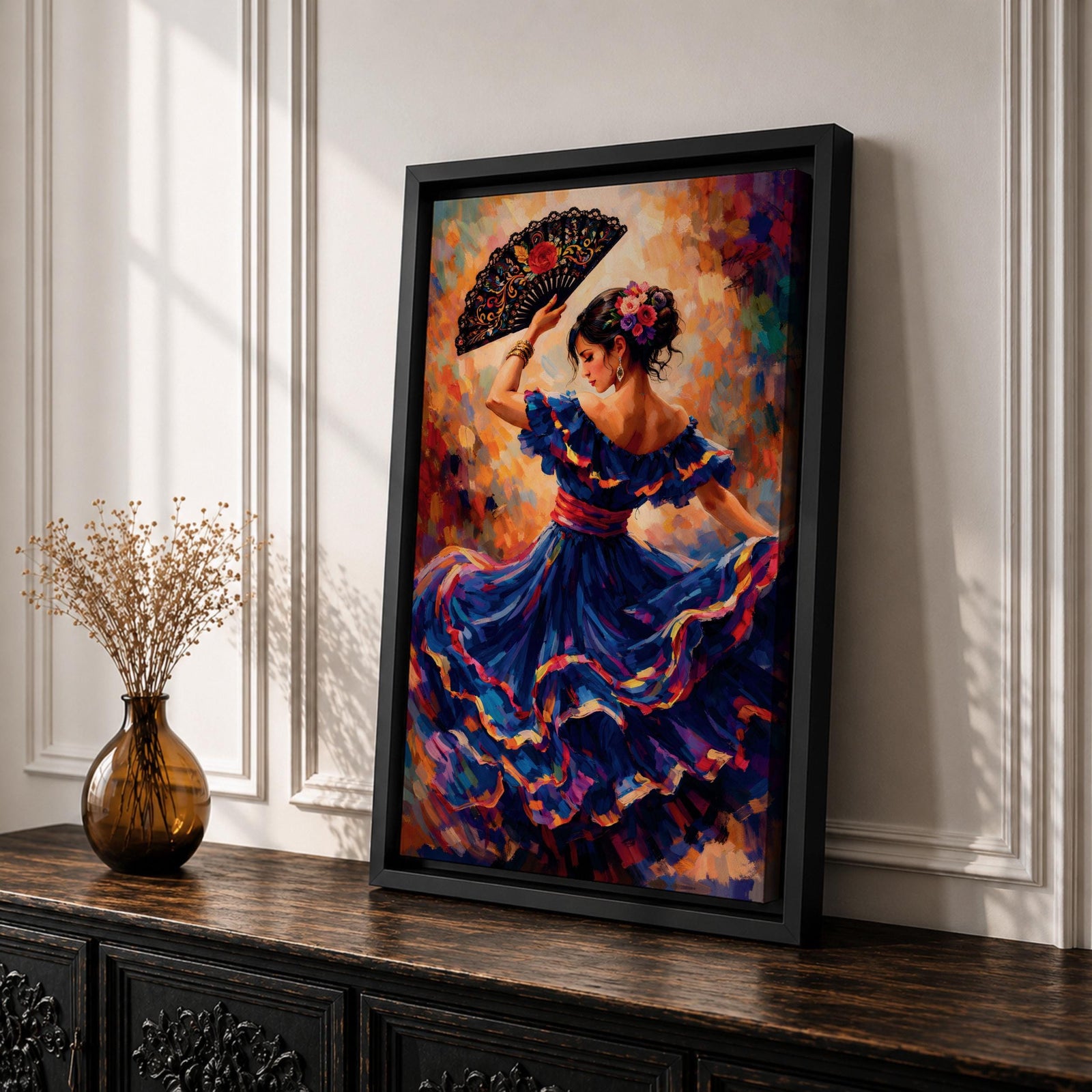 A flamenco dancer in a flowing blue dress moves gracefully with one arm raised holding an ornate fan, her skirt swirling in layered motion with vivid brushstrokes of red, gold, and violet, while her floral hairpiece and poised posture enhance the sense of rhythm and expressive movement in a richly textured composition.