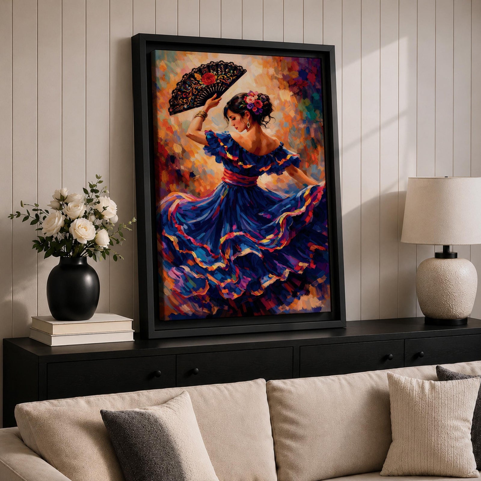 A flamenco dancer in a flowing blue dress moves gracefully with one arm raised holding an ornate fan, her skirt swirling in layered motion with vivid brushstrokes of red, gold, and violet, while her floral hairpiece and poised posture enhance the sense of rhythm and expressive movement in a richly textured composition.