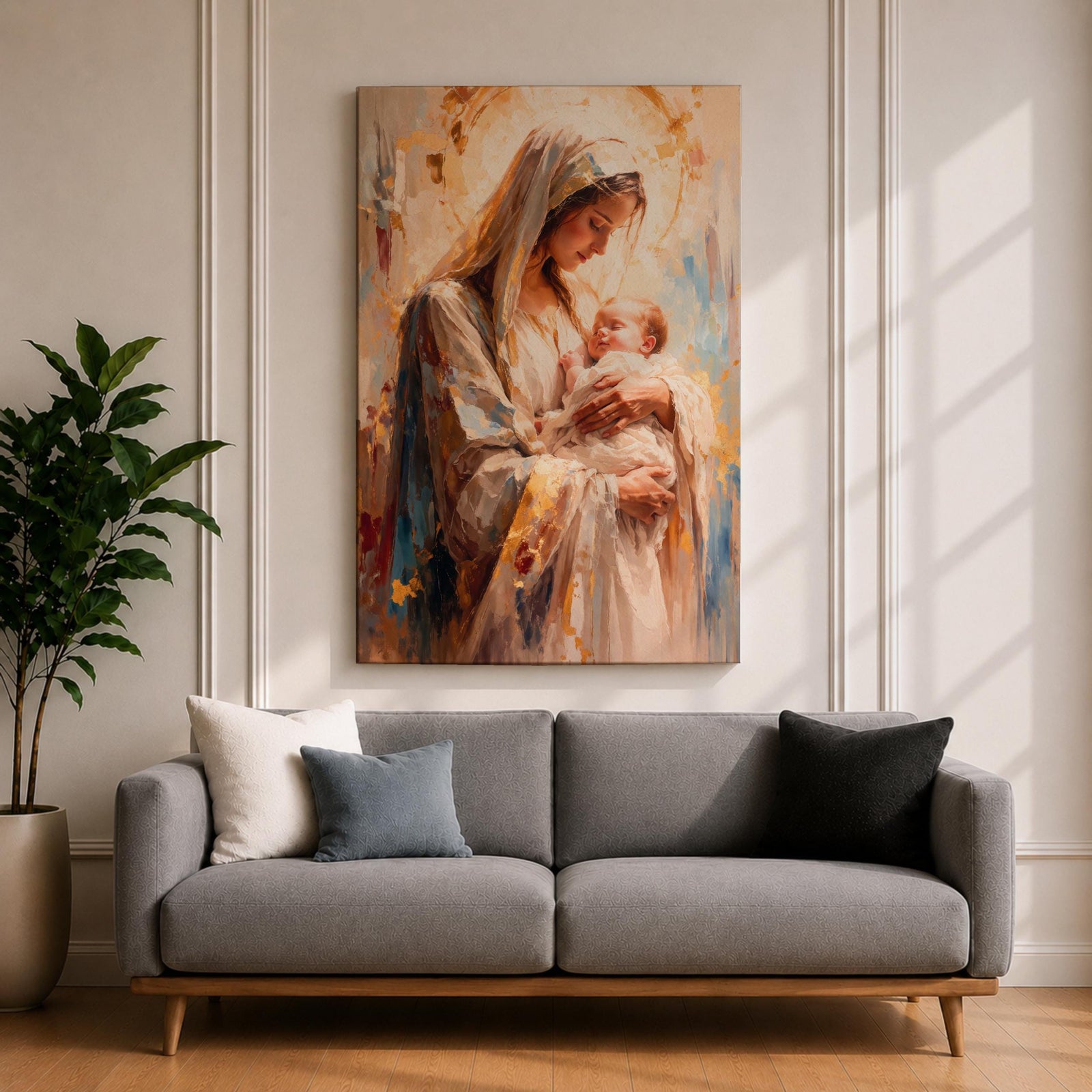 A framed canvas painting depicting Madonna and Child, showing the Virgin Mary tenderly holding baby Jesus. The artwork features soft brush strokes and warm tones, emphasizing the loving bond between mother and child in a classical religious style.