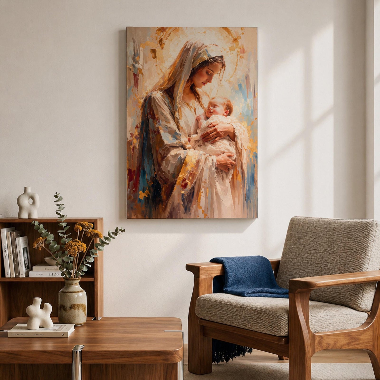 A framed canvas painting depicting Madonna and Child, showing the Virgin Mary tenderly holding baby Jesus. The artwork features soft brush strokes and warm tones, emphasizing the loving bond between mother and child in a classical religious style.