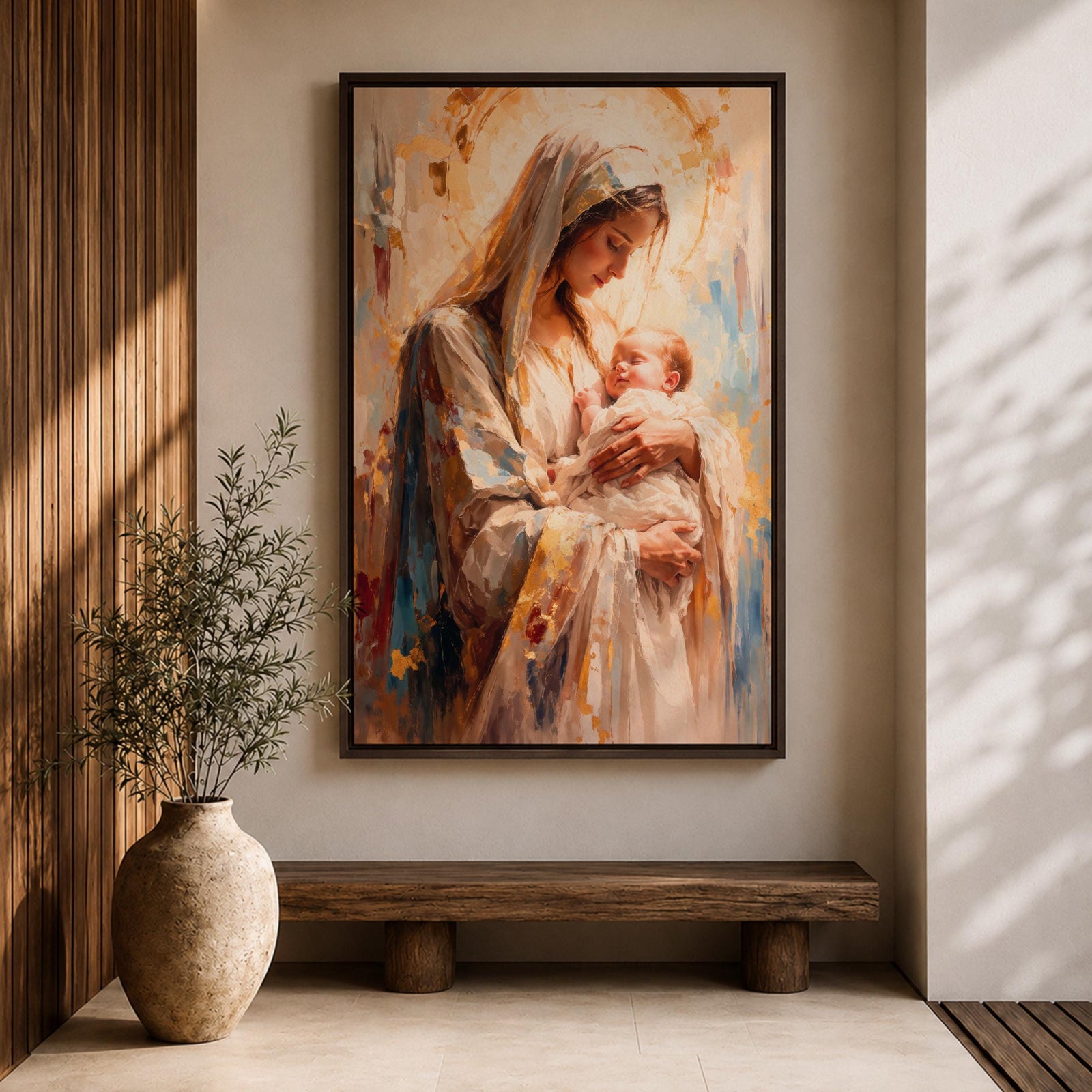 A framed canvas painting depicting Madonna and Child, showing the Virgin Mary tenderly holding baby Jesus. The artwork features soft brush strokes and warm tones, emphasizing the loving bond between mother and child in a classical religious style.