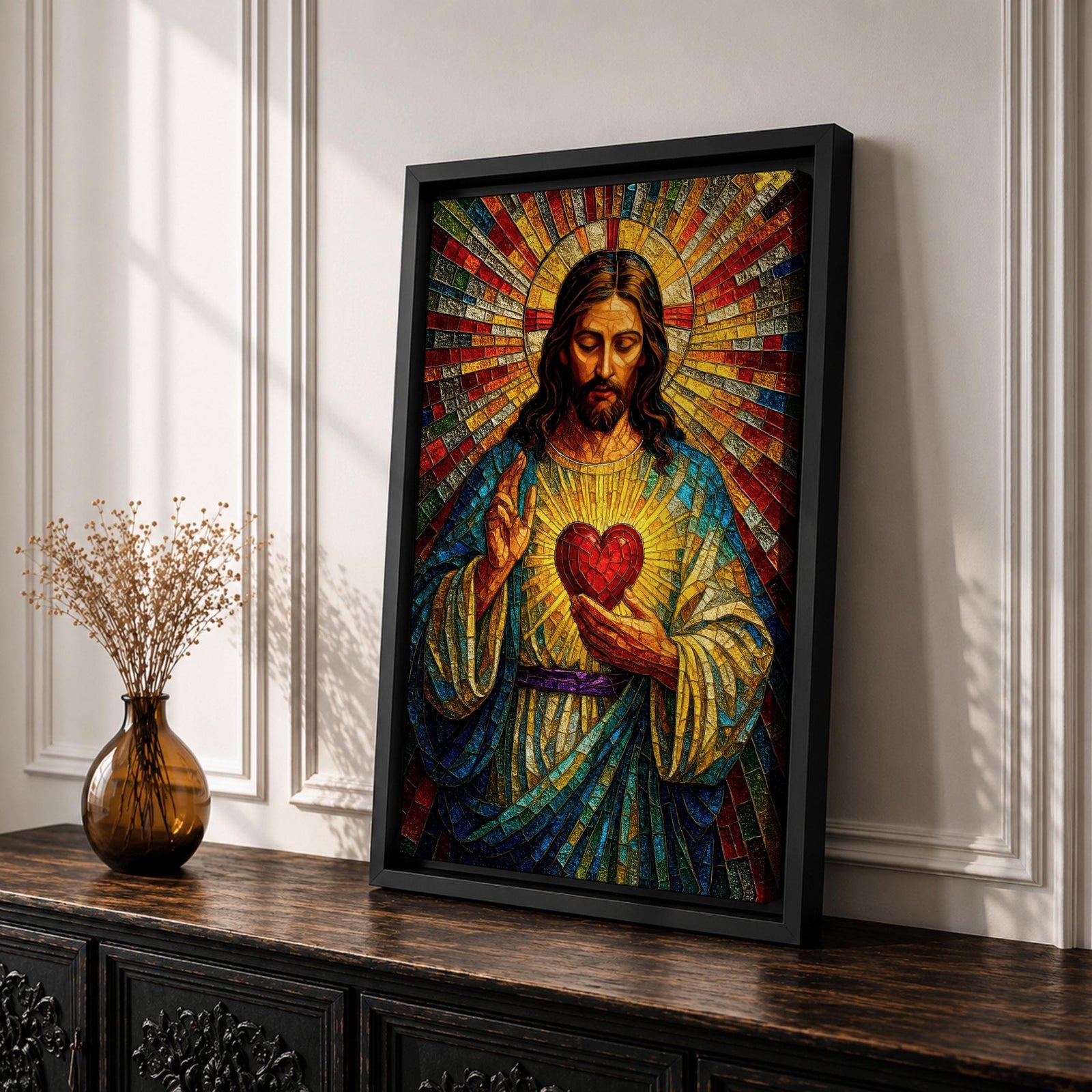 A vibrant mosaic-style stained glass artwork depicting the Sacred Heart of Jesus with radiant beams emanating from a glowing heart at the center. The figure is shown with long hair and a beard, wearing traditional robes, holding a heart symbolizing love and compassion, rendered in intricate colored glass tiles.