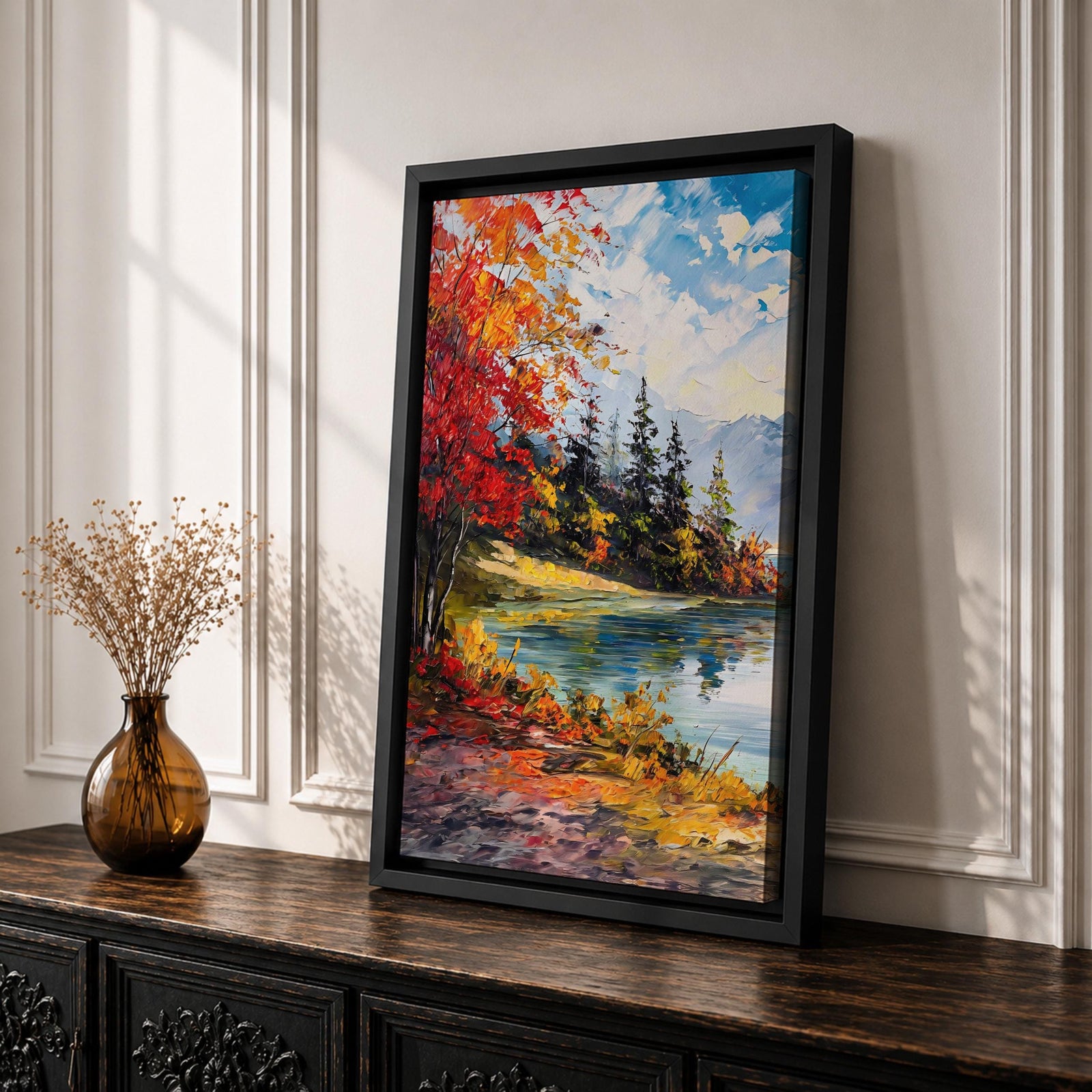 A vibrant impasto painting depicting an autumn lake scene with colorful red and orange foliage on the shore, evergreen trees, and distant mountains under a partly cloudy blue sky, rendered with thick textured brushstrokes creating a rich, dynamic landscape composition.