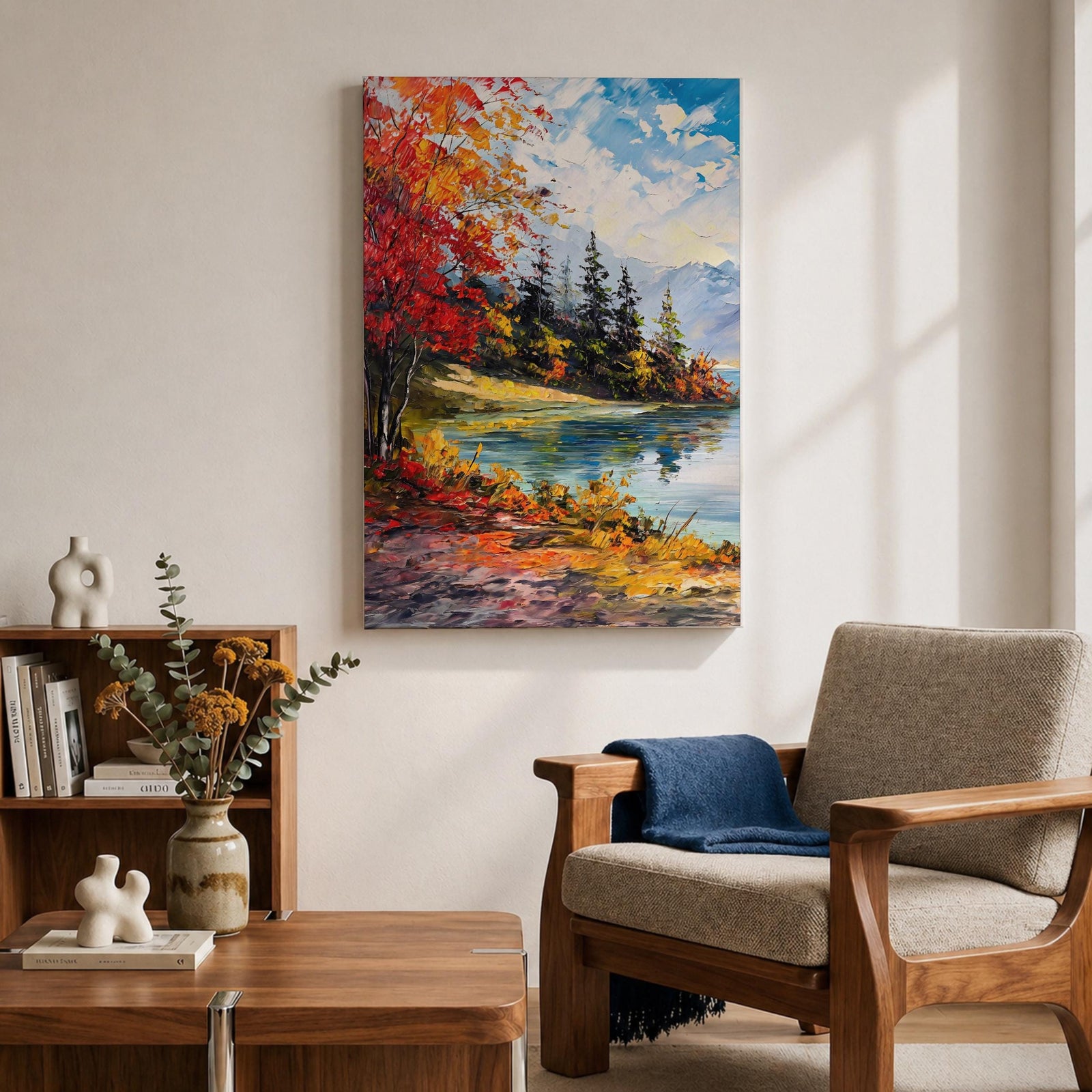 A vibrant impasto painting depicting an autumn lake scene with colorful red and orange foliage on the shore, evergreen trees, and distant mountains under a partly cloudy blue sky, rendered with thick textured brushstrokes creating a rich, dynamic landscape composition.