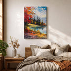 A vibrant impasto painting depicting an autumn lake scene with colorful red and orange foliage on the shore, evergreen trees, and distant mountains under a partly cloudy blue sky, rendered with thick textured brushstrokes creating a rich, dynamic landscape composition.