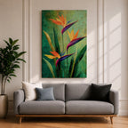 A vibrant painting of Bird of Paradise flowers (Strelitzia) featuring bold orange and purple petals with lush green leaves on a textured green background. The floral composition is realistic with a tropical theme, capturing the exotic beauty of these iconic flowers in a framed canvas style.