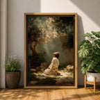 Framed artwork of Jesus praying in the Garden of Gethsemane, kneeling beneath a tree as soft rays of light shine down from above. Set in a modern living room, the canvas rests on a wooden console beside plants and neutral decor.