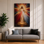 A radiant depiction of Divine Mercy of Jesus shows Jesus standing with one hand raised in blessing and the other pointing to his heart, from which red and pale rays emanate. The figure is surrounded by vibrant rays of light, rendered in a classical religious art style on canvas.