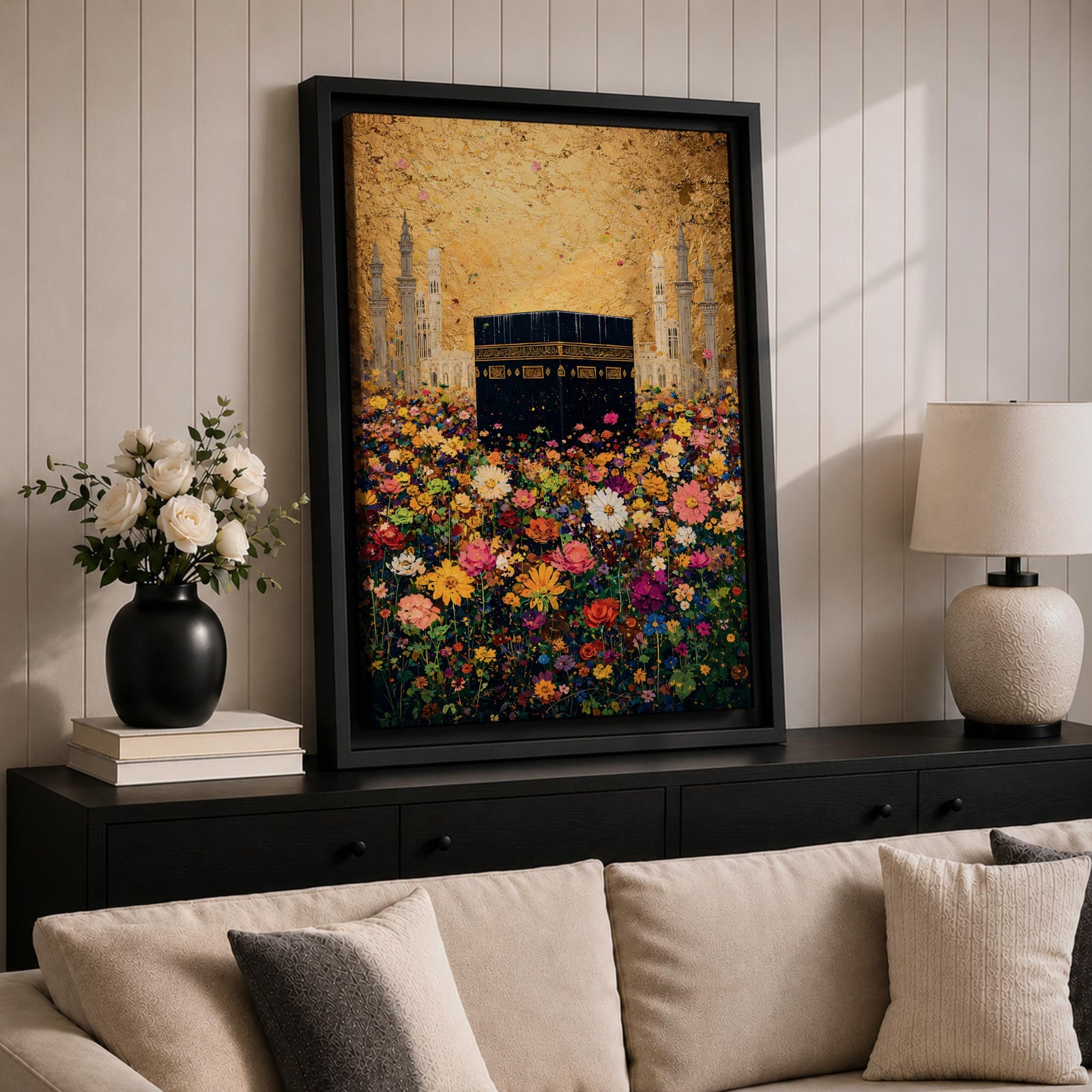 The Kaaba stands at the center of a vibrant field of multicolored flowers, surrounded by softly rendered mosque minarets in the background, set beneath a radiant golden sky with textured brushwork that blends architectural form with blooming botanical elements in a richly layered and luminous composition.