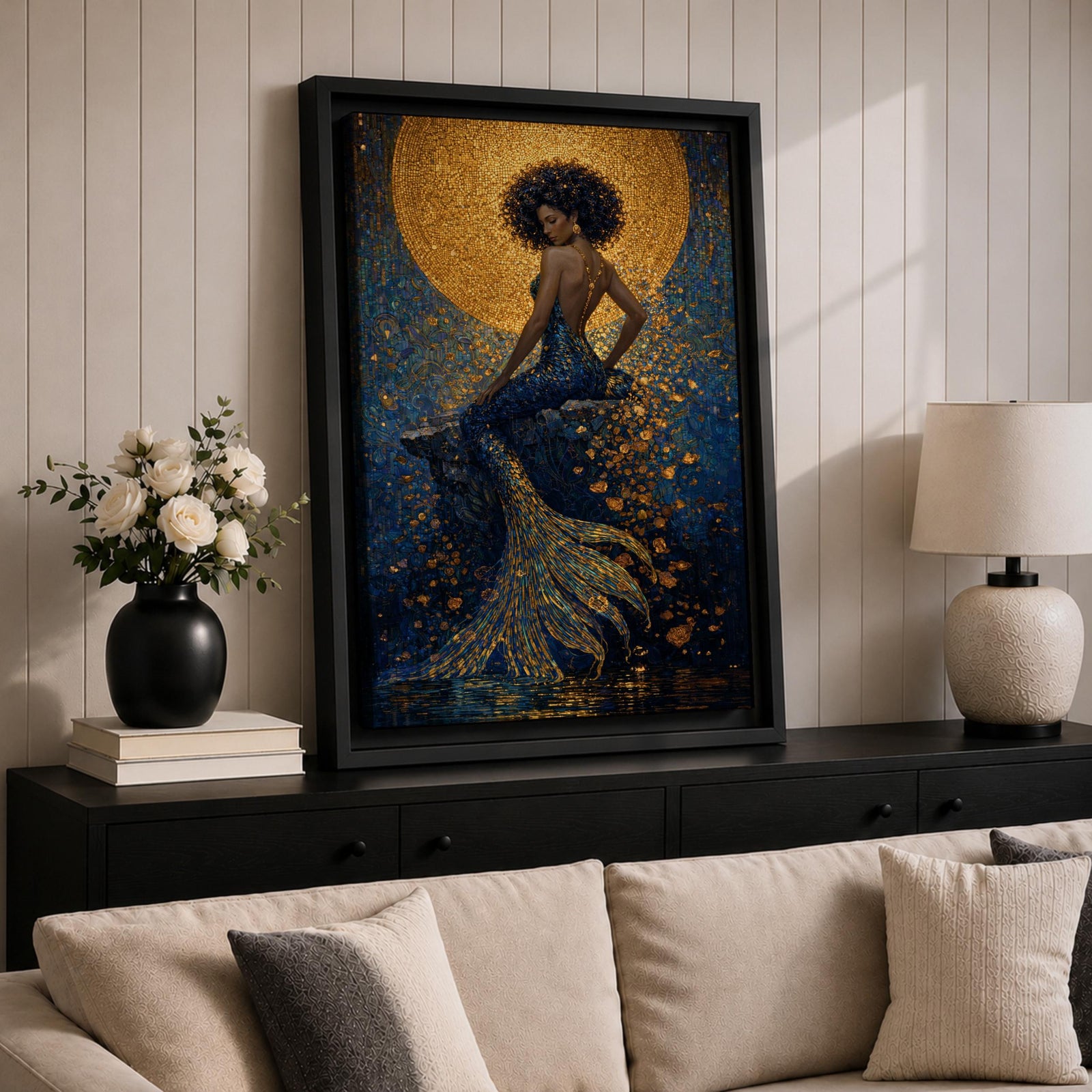 A striking fantasy painting of a Black mermaid seated gracefully with her back turned, her voluminous afro illuminated by a glowing golden moon behind her, while her long textured tail flows downward in shimmering gold and deep blue tones, surrounded by abstract ocean textures that create a rich and luminous underwater composition.