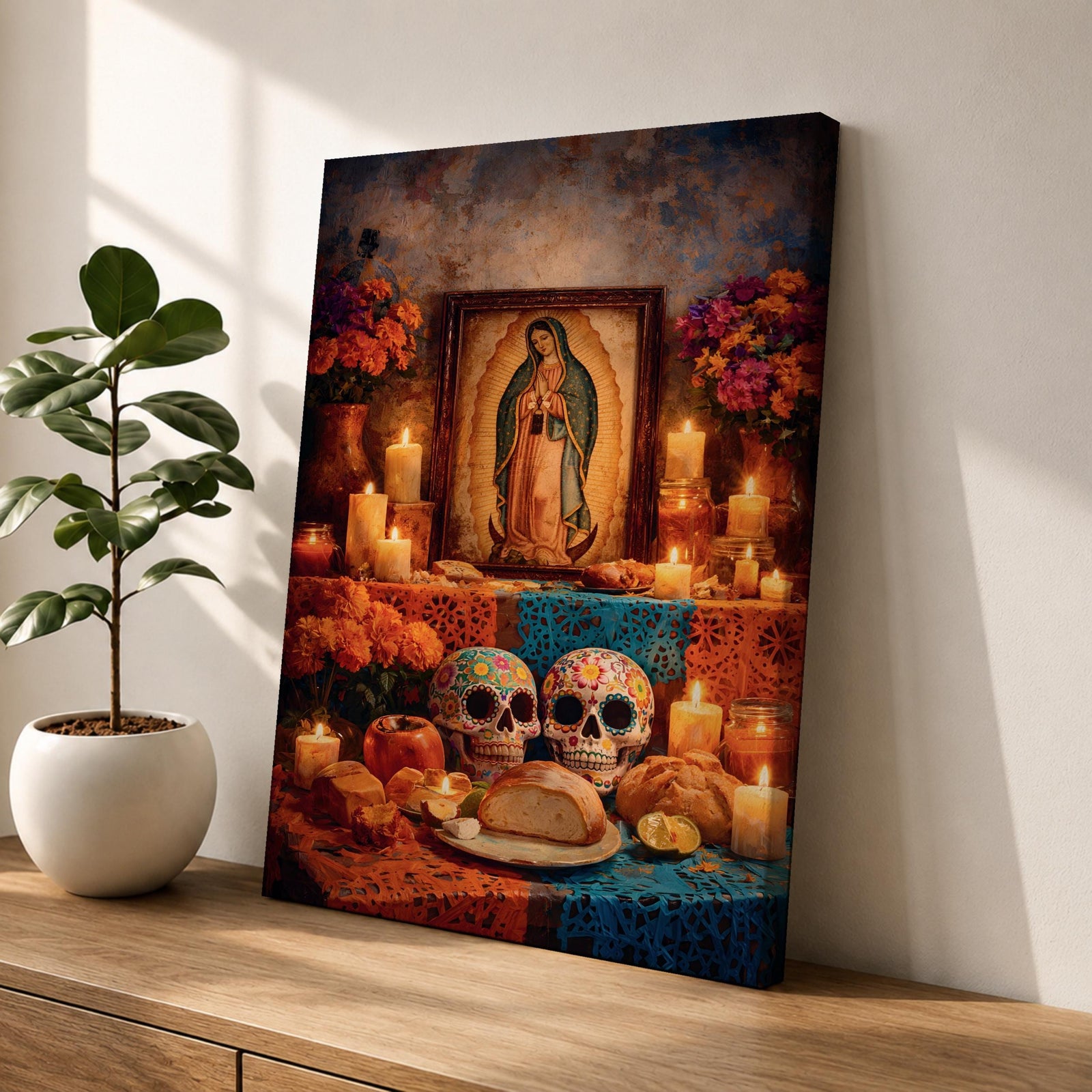 A framed canvas wall art depicting Our Lady of Guadalupe with a traditional Mexican altar featuring candles, flowers, decorated sugar skulls, bread, and fruit, rendered in a detailed, realistic style emphasizing cultural and religious symbolism.