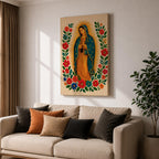 A framed stitched style art print depicting Our Lady of Guadalupe with hands clasped in prayer, surrounded by a radiant golden halo and vibrant floral embroidery in red, blue, and green. The image captures the traditional Mexican Catholic iconography with intricate textile detail and a serene expression.