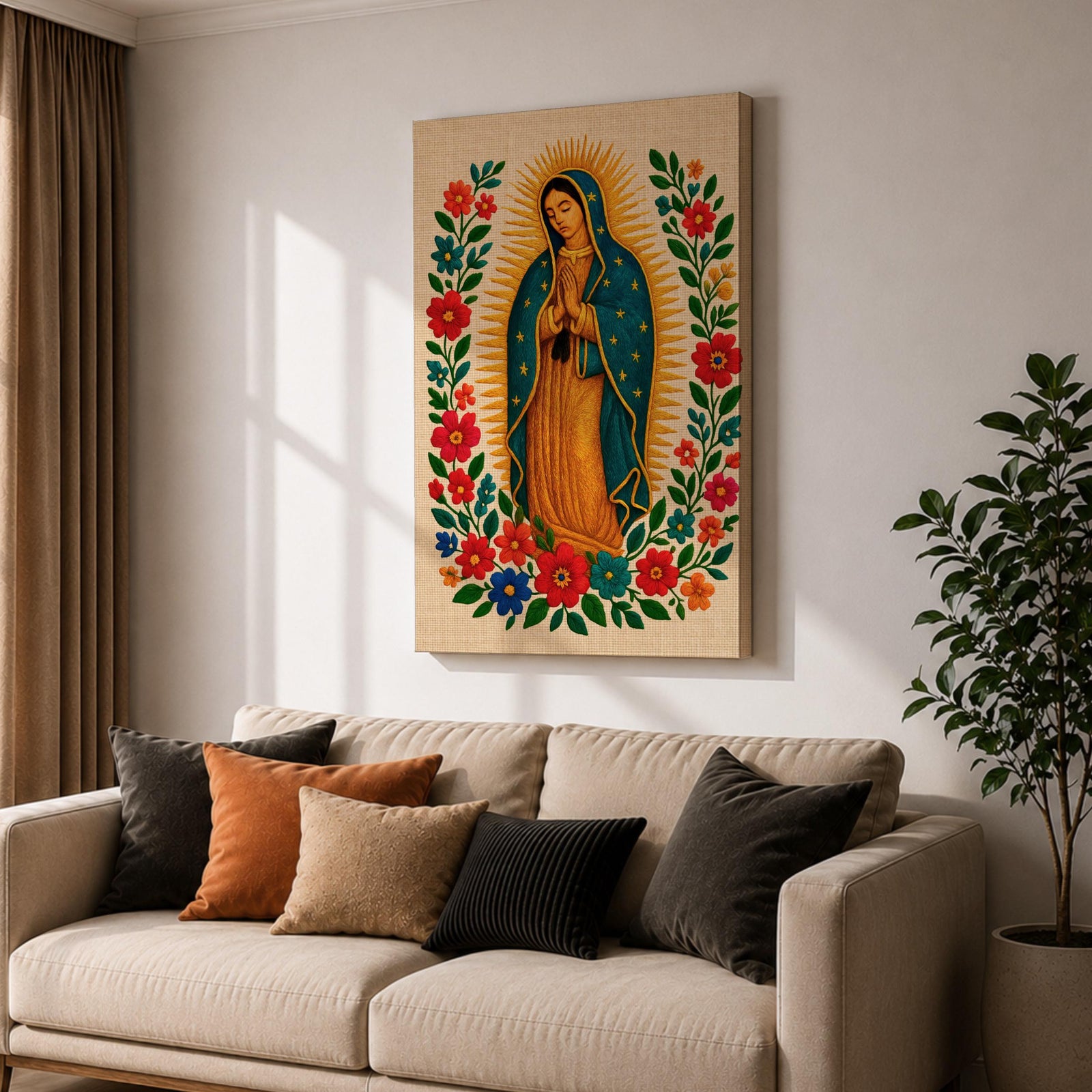 A framed stitched style art print depicting Our Lady of Guadalupe with hands clasped in prayer, surrounded by a radiant golden halo and vibrant floral embroidery in red, blue, and green. The image captures the traditional Mexican Catholic iconography with intricate textile detail and a serene expression.
