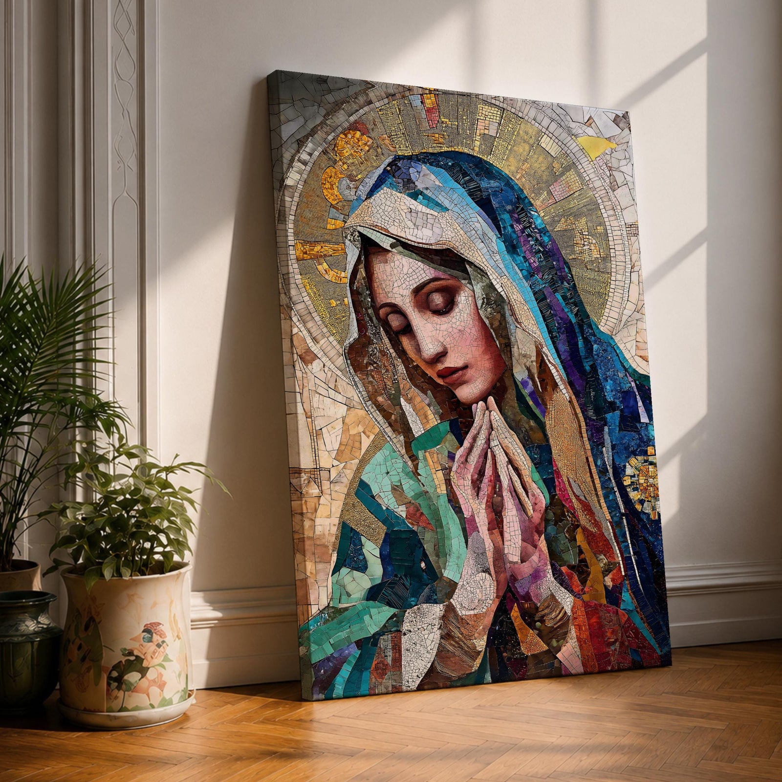 A mosaic-style artwork depicting Virgin Mary with hands clasped in prayer and eyes closed, wearing a blue and white veil with a golden halo behind her head. The piece uses intricate tile fragments to create a stained glass effect, emphasizing religious Christian themes with detailed textures and vibrant colors.