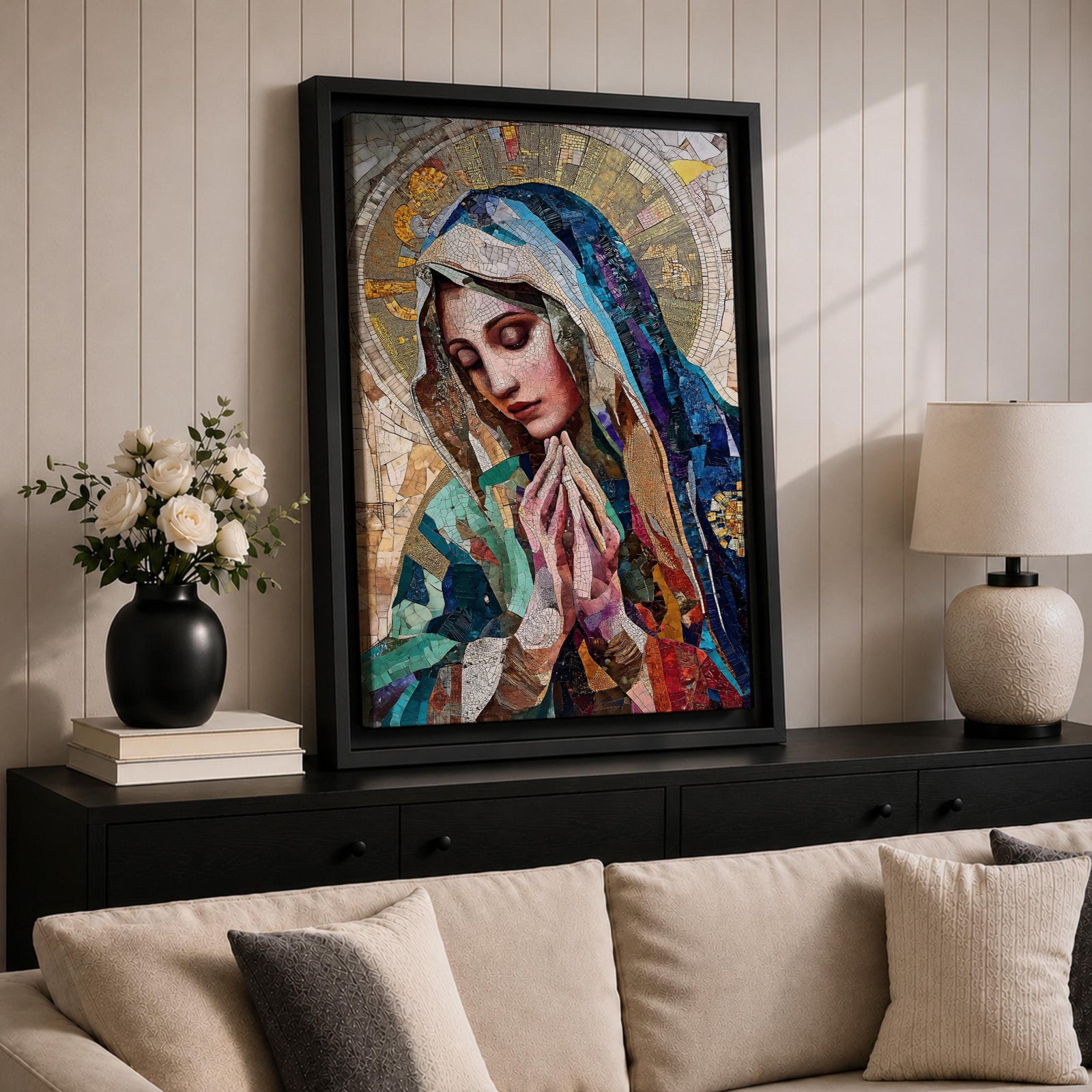 A mosaic-style artwork depicting Virgin Mary with hands clasped in prayer and eyes closed, wearing a blue and white veil with a golden halo behind her head. The piece uses intricate tile fragments to create a stained glass effect, emphasizing religious Christian themes with detailed textures and vibrant colors.