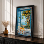 A vibrant framed canvas painting depicting a lemon tree bursting with ripe yellow lemons viewed through an open blue window overlooking a coastal Mediterranean scene. The artwork captures lush green leaves, a floral cloth on the windowsill, and a distant sea horizon in a realistic natural style.