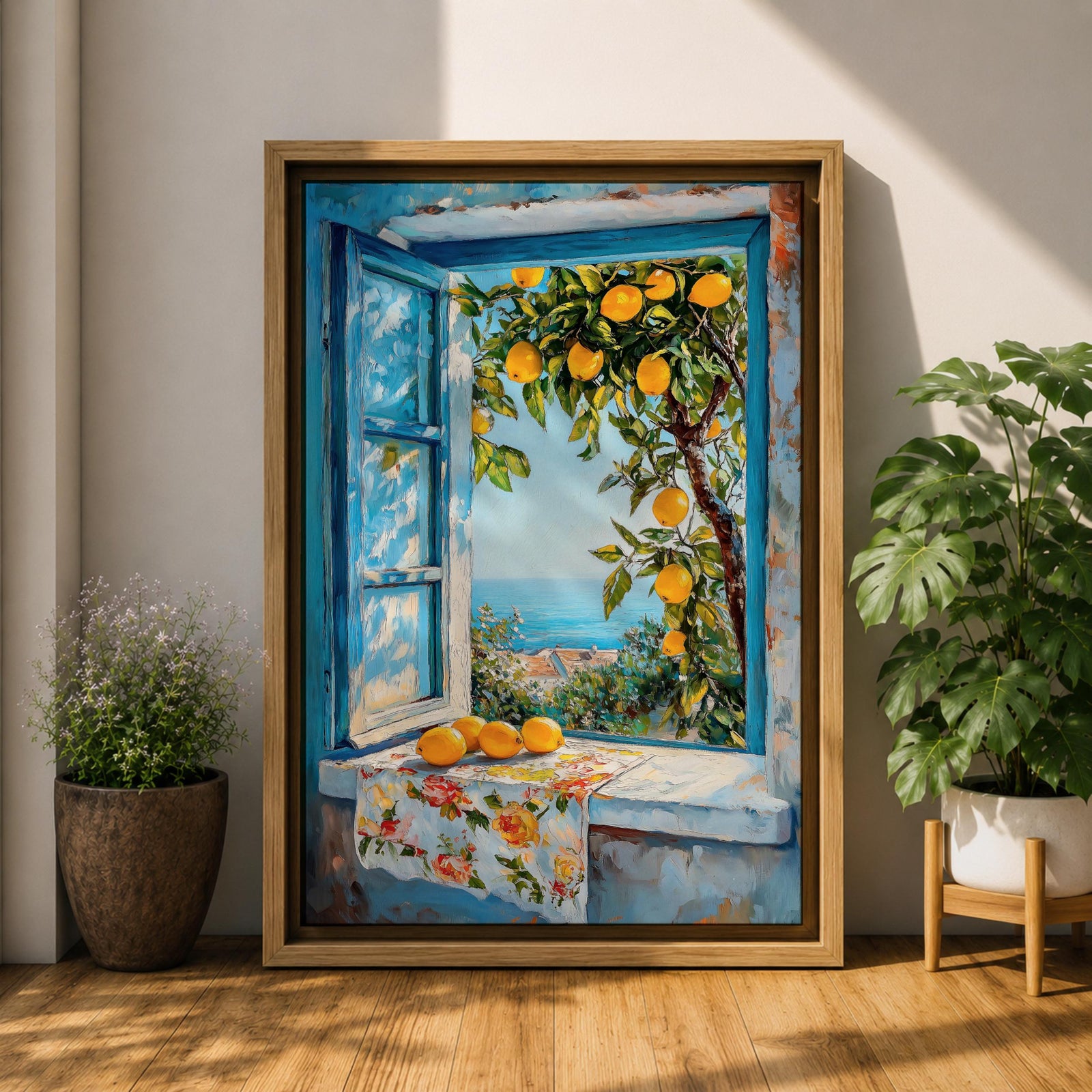 A vibrant framed canvas painting depicting a lemon tree bursting with ripe yellow lemons viewed through an open blue window overlooking a coastal Mediterranean scene. The artwork captures lush green leaves, a floral cloth on the windowsill, and a distant sea horizon in a realistic natural style.