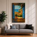 A framed canvas painting depicting a Mediterranean window opening to a seaside coastal view with terracotta-roofed houses, lush greenery, and a distant sailboat on the blue sea, rendered in a realistic landscape style with vibrant colors and detailed brushwork.