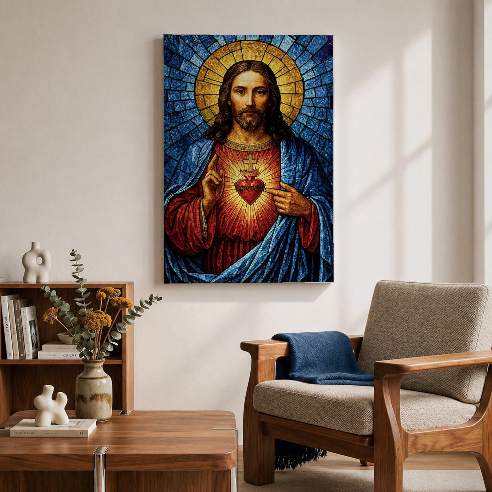 A stained glass style depiction of the Sacred Heart of Jesus shows Jesus with long hair and beard, wearing a red robe and blue cloak. His heart is radiant with light, crowned with a cross and surrounded by thorns. The background features geometric blue and gold stained glass tiles forming a halo.