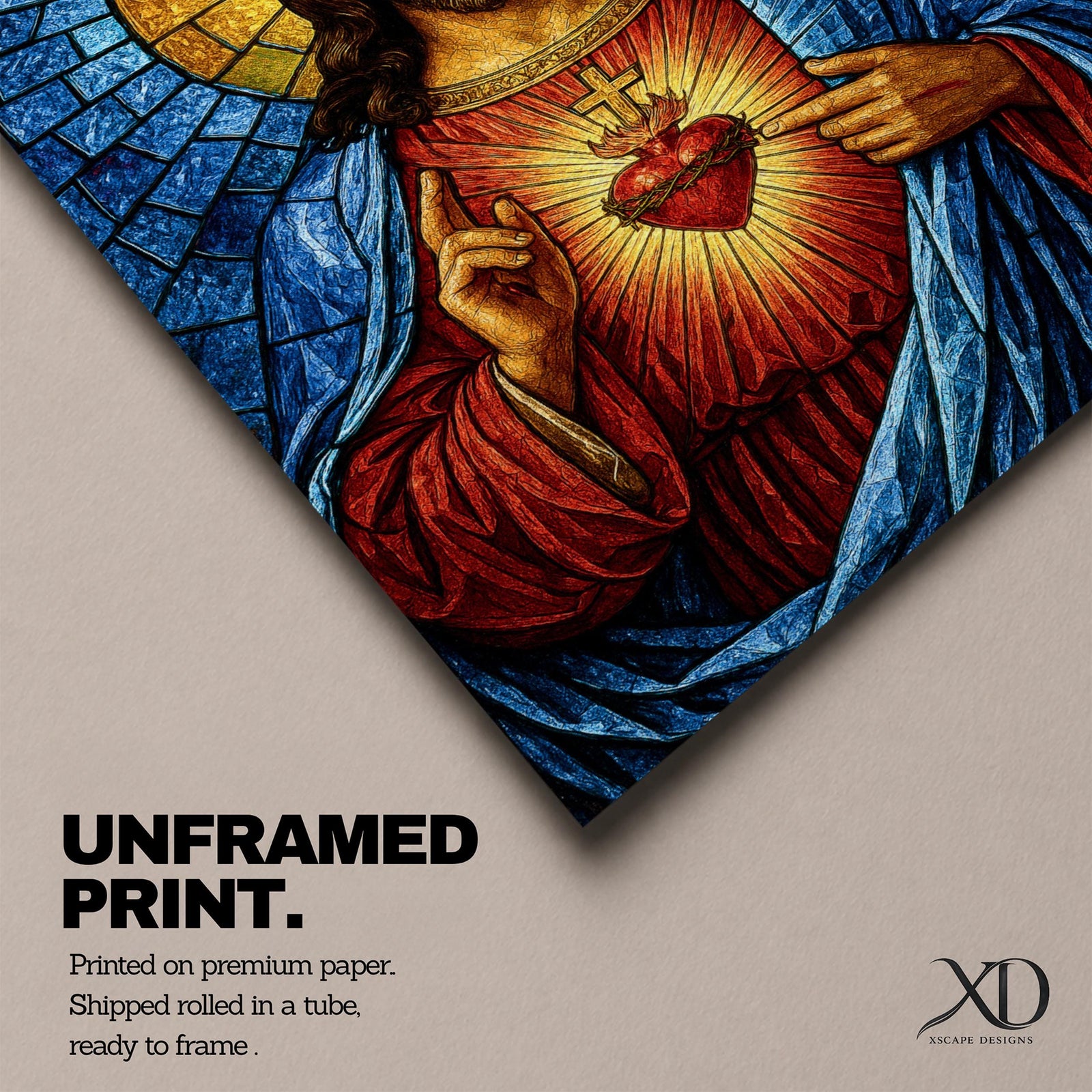 A stained glass style depiction of the Sacred Heart of Jesus shows Jesus with long hair and beard, wearing a red robe and blue cloak. His heart is radiant with light, crowned with a cross and surrounded by thorns. The background features geometric blue and gold stained glass tiles forming a halo.