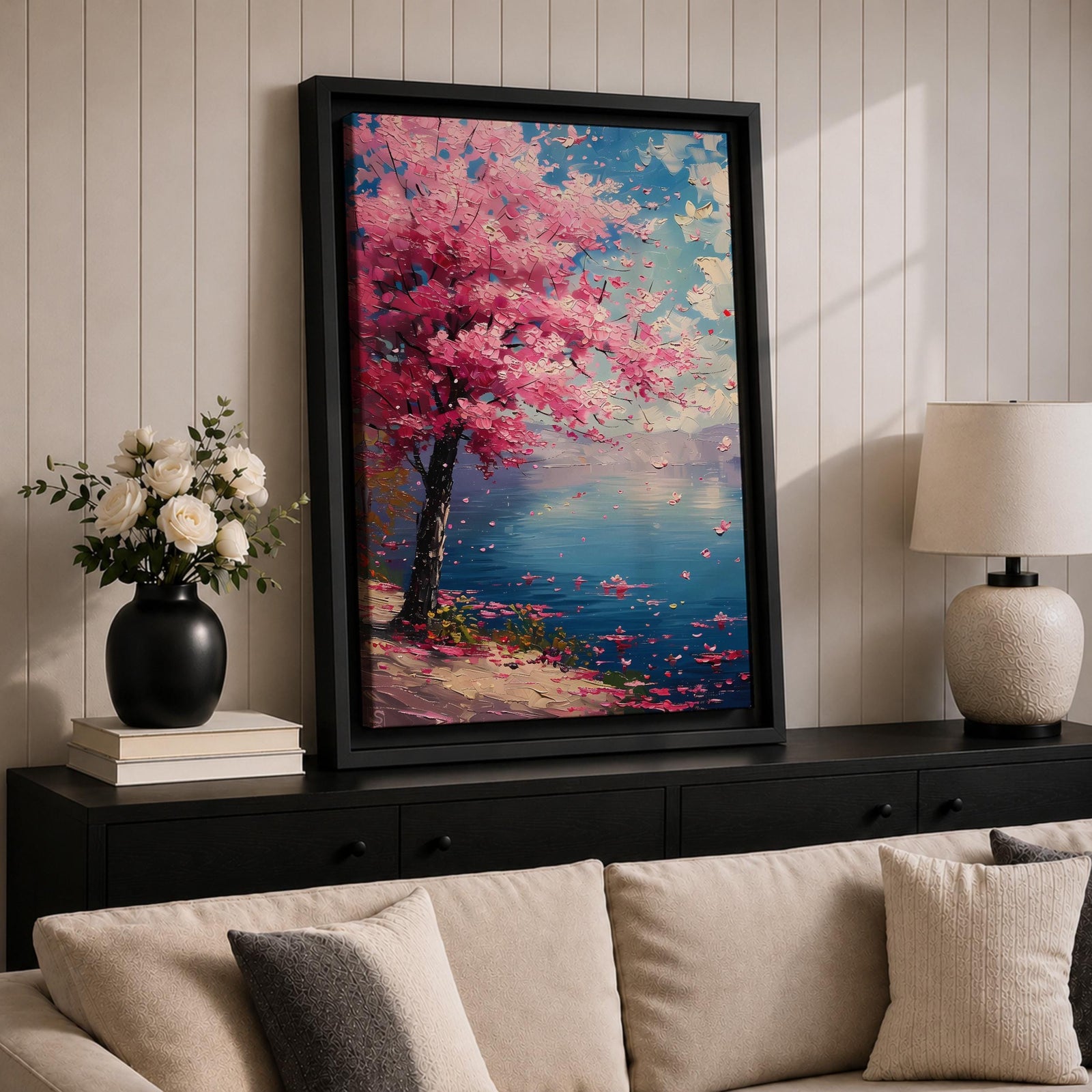 This impasto style painting depicts a cherry blossom tree with vibrant pink flowers beside a calm blue lake under a bright sky. The textured brushstrokes create a vivid floral landscape scene emphasizing the Japanese sakura tree in a natural setting.