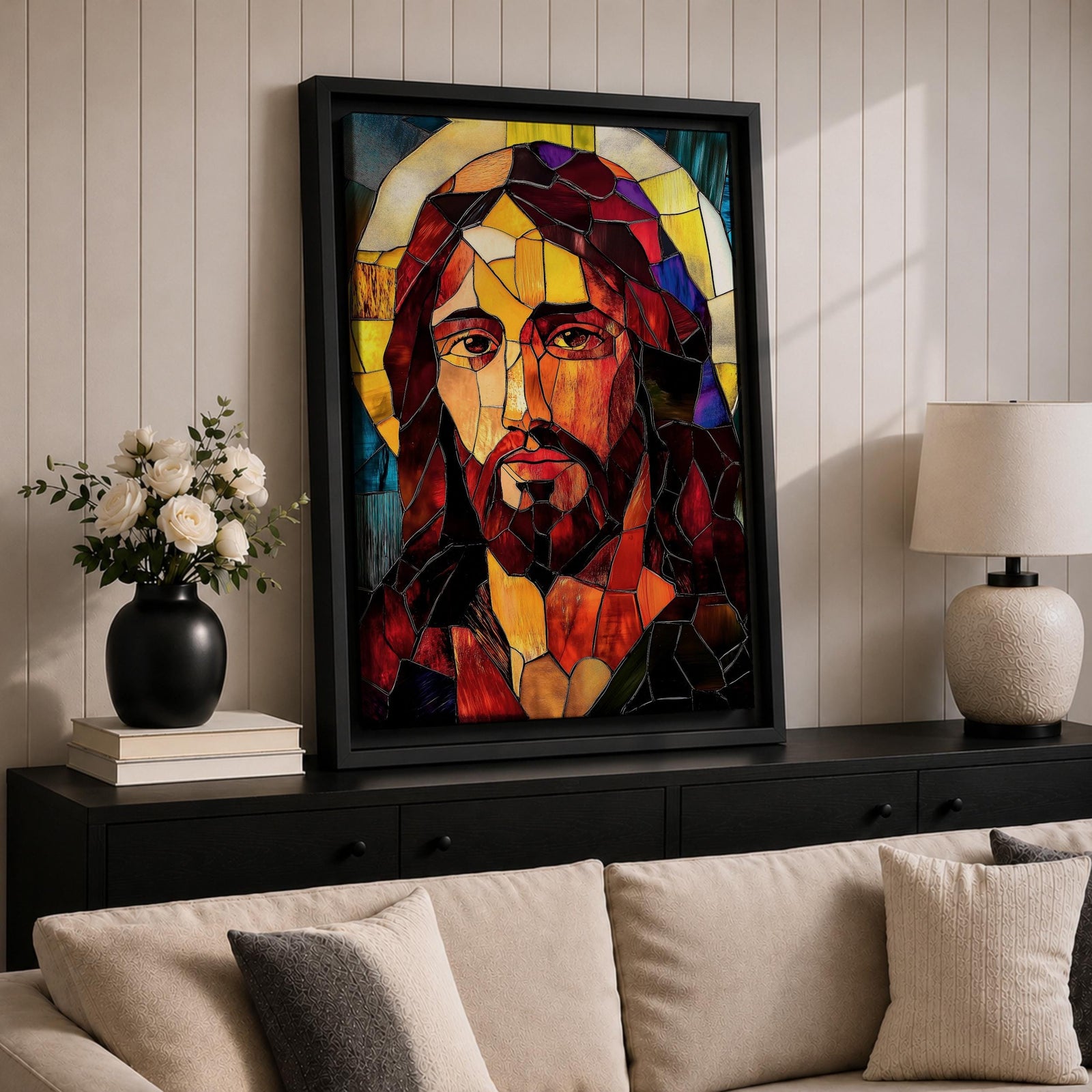 A stained glass mosaic portrait of Jesus Christ featuring vibrant glass fragments in warm tones with a halo behind his head. The artwork uses geometric shapes and rich colors typical of stained glass style, capturing a solemn and iconic religious figure in a mosaic-like composition.
