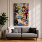 A vibrant Mediterranean café scene featuring a cozy outdoor patio with tables and chairs, colorful flowers cascading from balconies, and a distant view of the sea. The artwork captures a lively coastal atmosphere with impressionistic brushstrokes and rich textures, evoking a warm and inviting cityscape.
