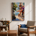A vibrant Mediterranean café scene featuring a cozy outdoor patio with tables and chairs, colorful flowers cascading from balconies, and a distant view of the sea. The artwork captures a lively coastal atmosphere with impressionistic brushstrokes and rich textures, evoking a warm and inviting cityscape.