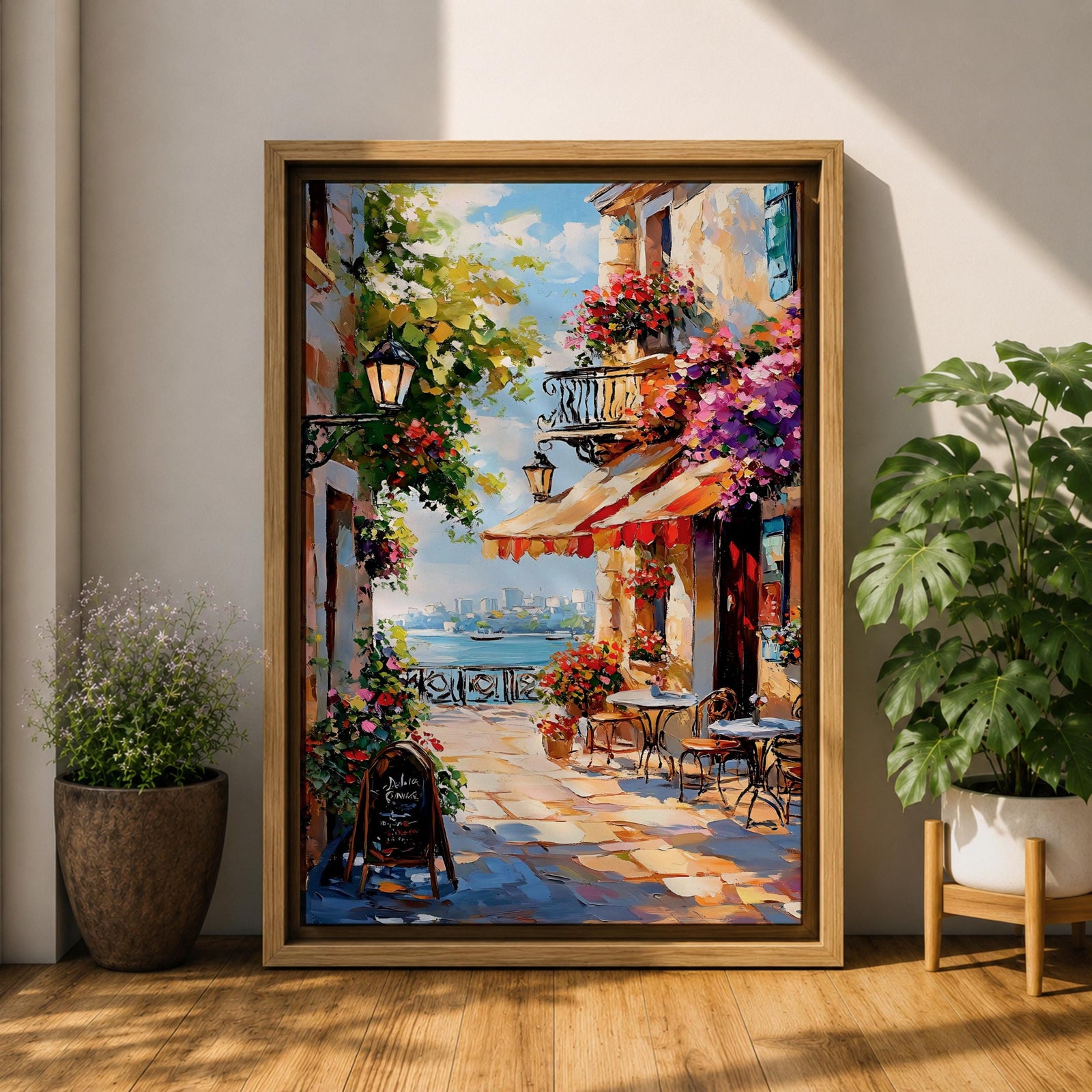 A vibrant Mediterranean café scene featuring a cozy outdoor patio with tables and chairs, colorful flowers cascading from balconies, and a distant view of the sea. The artwork captures a lively coastal atmosphere with impressionistic brushstrokes and rich textures, evoking a warm and inviting cityscape.