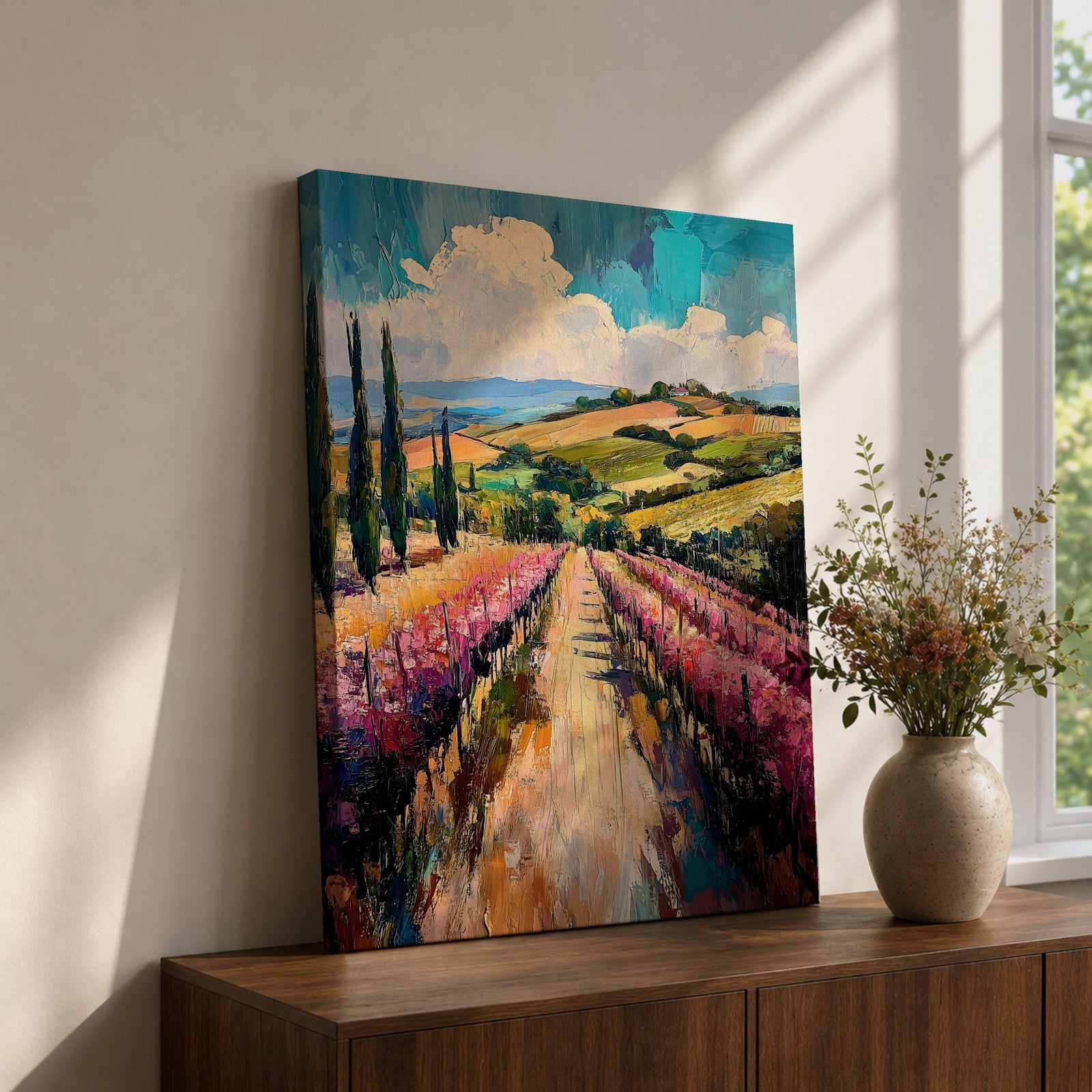 This impasto style oil painting depicts a vineyard landscape with rows of grapevines stretching into the distance under a partly cloudy sky. The textured brushstrokes create depth and vibrancy, highlighting the rolling hills and tall cypress trees characteristic of a country vineyard scene.
