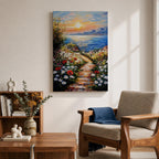 An impasto style framed canvas painting depicting a coastal sunset path bordered by vibrant wildflowers leading to a calm sea with distant mountains under a colorful sky. The textured brush strokes emphasize the natural landscape and seaside atmosphere.