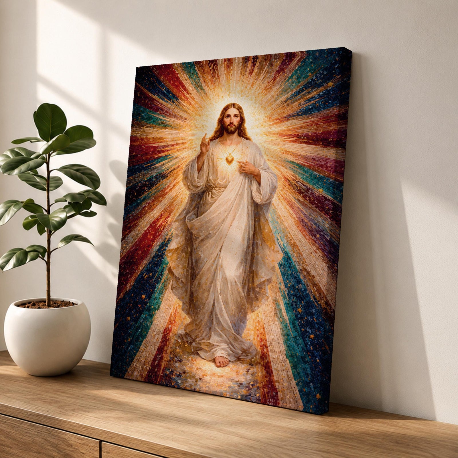 A mosaic-style framed canvas depicting the Sacred Heart of Jesus with radiant beams of light emanating from the heart. The figure is dressed in flowing robes with one hand raised in blessing and the other pointing to the glowing heart, set against a vibrant, colorful mosaic background.
