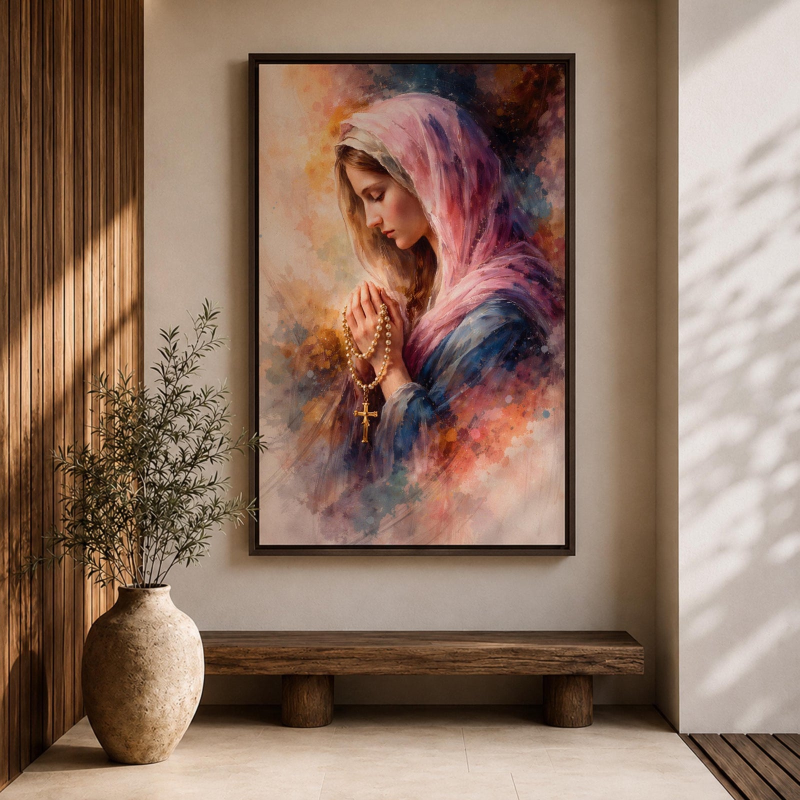 A watercolor style painting of the Virgin Mary wearing a pink hooded shawl, holding a rosary with a gold cross, her eyes closed in prayer, surrounded by soft, blended warm and cool colors creating a serene and contemplative atmosphere.