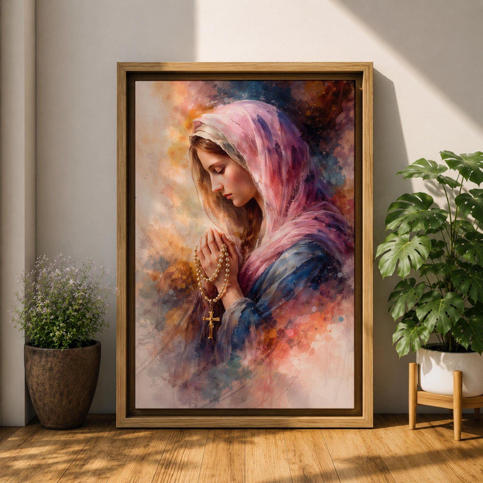 A watercolor style painting of the Virgin Mary wearing a pink hooded shawl, holding a rosary with a gold cross, her eyes closed in prayer, surrounded by soft, blended warm and cool colors creating a serene and contemplative atmosphere.