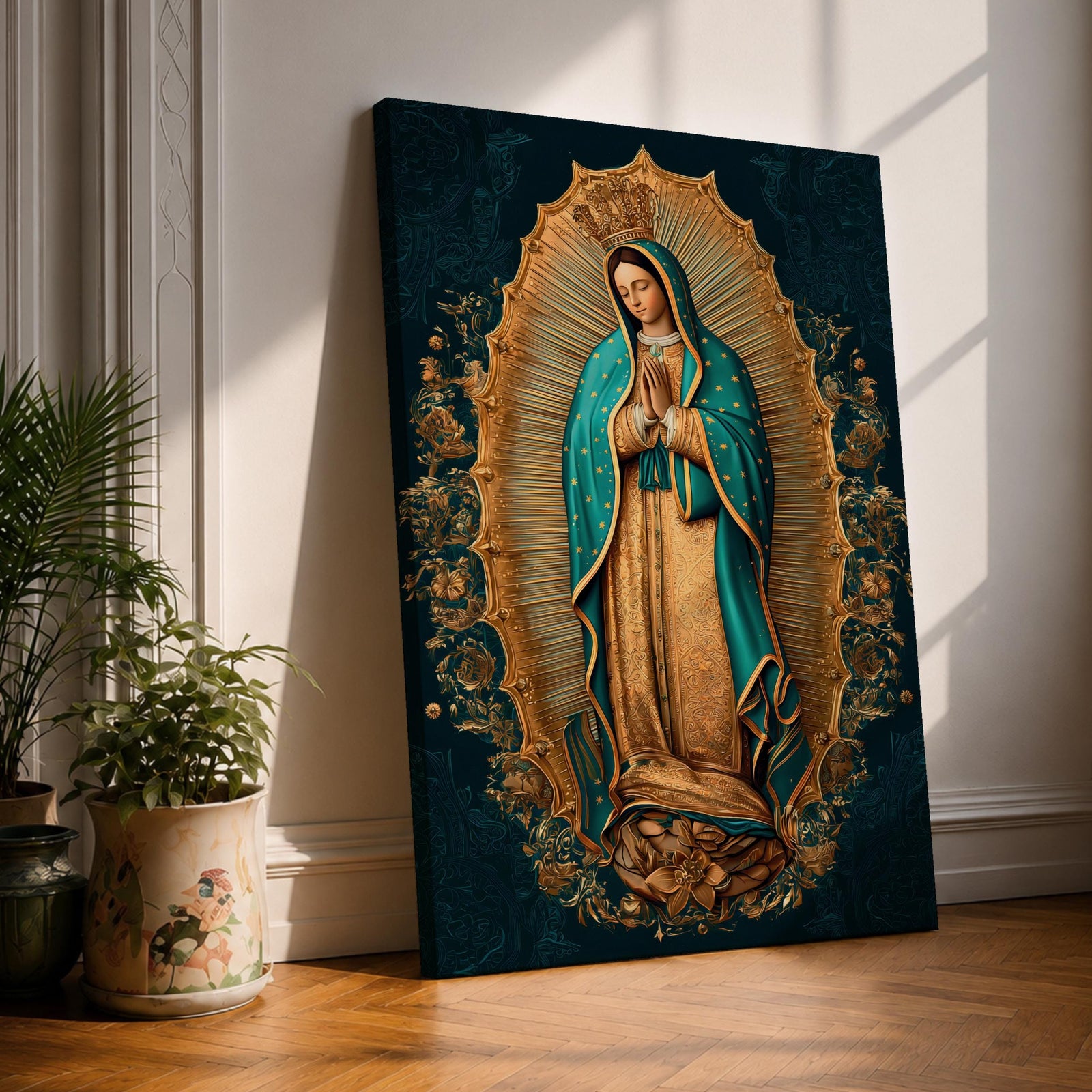 A detailed framed canvas artwork depicting Our Lady of Guadalupe standing with hands clasped in prayer, surrounded by a radiant golden aura and floral motifs, rendered in a traditional style emphasizing intricate patterns and symbolic elements.