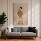 A framed canvas artwork depicting Jesus walking on water, showing him in a flowing robe with rippling water beneath and a glowing halo behind his head. The style is realistic with textured brush strokes emphasizing the water’s movement and the figure’s serene posture.