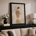 A framed canvas artwork depicting Jesus walking on water, showing him in a flowing robe with rippling water beneath and a glowing halo behind his head. The style is realistic with textured brush strokes emphasizing the water’s movement and the figure’s serene posture.