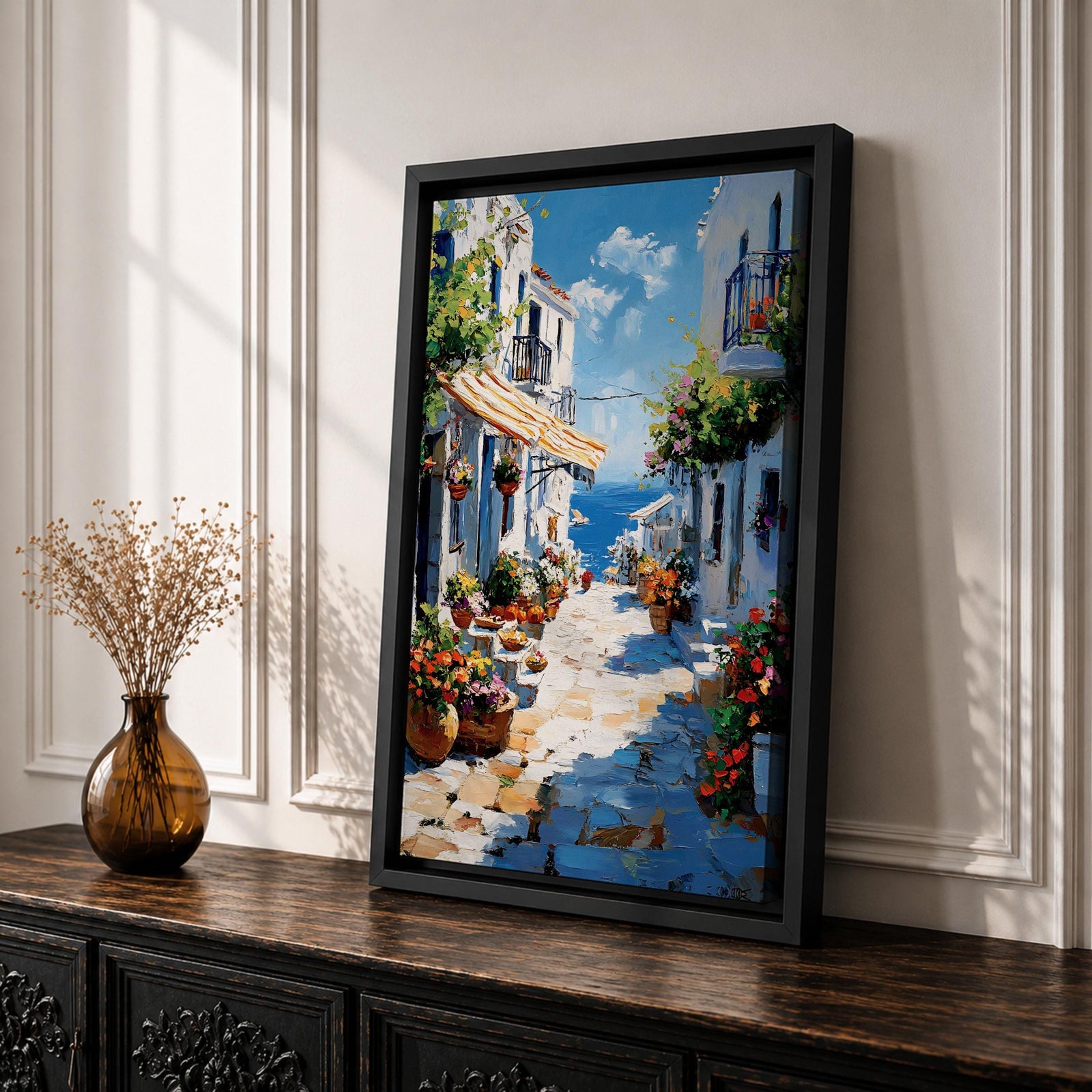 An impasto style painting depicting a charming Greek island village street with whitewashed buildings, colorful flowers in pots, balconies, and a view of the blue sea under a partly cloudy sky. The textured brushstrokes create a vivid Mediterranean coastal atmosphere.