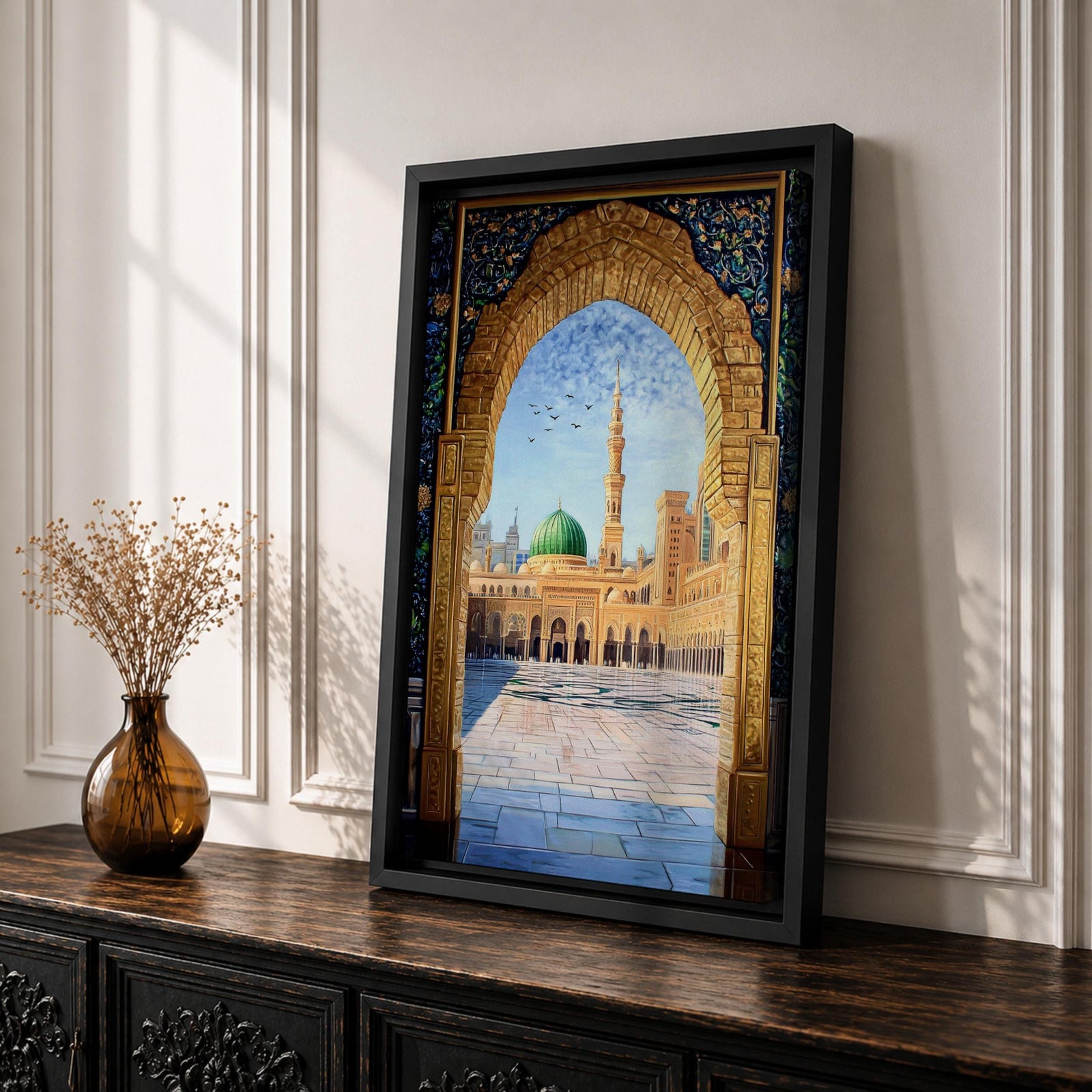 Artwork of Masjid Al Nabawi in Medina seen through an ornate stone arch with intricate Islamic patterns, featuring the iconic green dome, tall minaret, and the mosque’s peaceful courtyard beneath a bright blue sky with birds in flight.