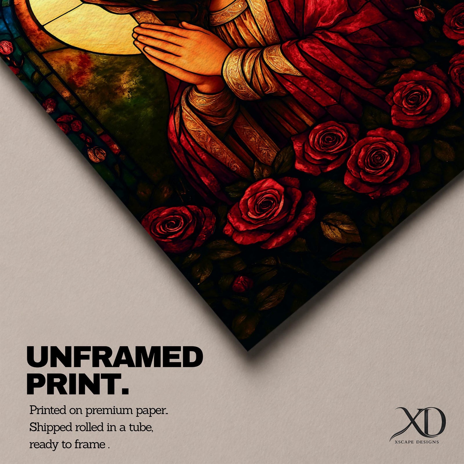 A stained glass style artwork depicting the Virgin Mary in a red robe with hands clasped in prayer, surrounded by a glowing halo and red roses at the bottom. The piece features intricate glass-like segments and rich colors, capturing a classic religious stained glass window aesthetic.