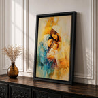 A framed canvas artwork depicting the Holy Family with Mary, Joseph, and baby Jesus in a tender embrace. The painting features warm tones and soft brush strokes, capturing the intimate moment of the Nativity scene with a focus on the figures' expressions and clothing details.