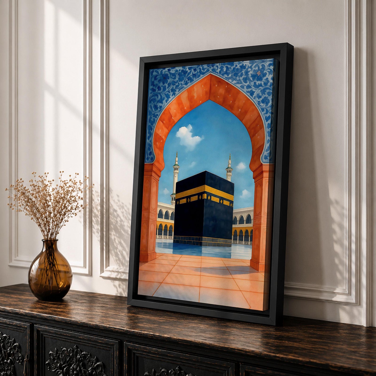 Artwork of the Kaaba at Masjid al-Haram framed by a Moroccan Moorish archway with blue ornamental patterns and warm terracotta tones overlooking the mosque courtyard.