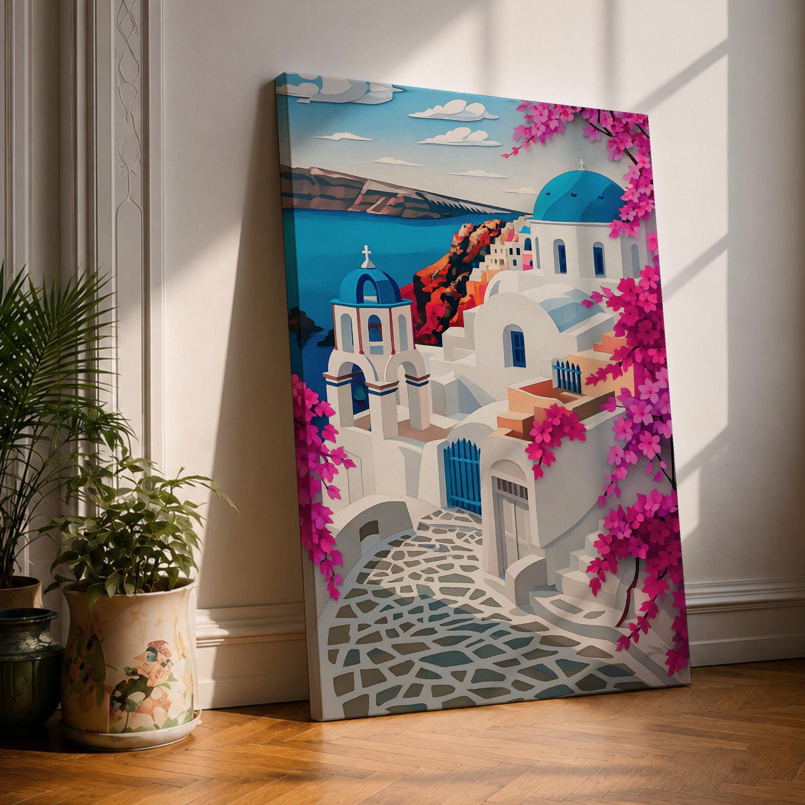 A vibrant framed canvas depicting Santorini, Greece, featuring iconic white buildings with blue domes, winding cobblestone paths, and bright bougainvillea flowers overlooking a deep blue sea, rendered in a clean, graphic style emphasizing architectural shapes and Mediterranean coastal charm.