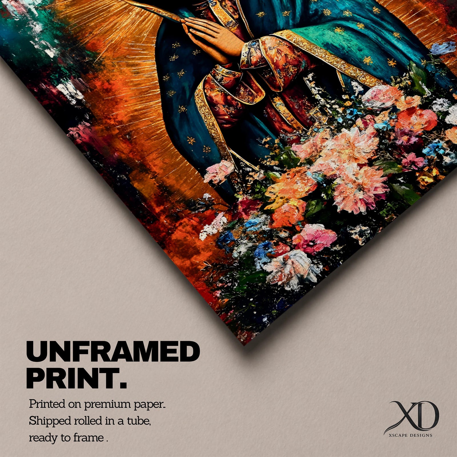 A vibrant framed canvas painting of Our Lady of Guadalupe depicts the Virgin of Guadalupe with hands clasped in prayer, wearing a teal mantle adorned with gold stars and surrounded by radiant light. The foreground features a colorful array of flowers, emphasizing the Catholic religious theme.