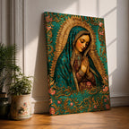 A vintage-style framed canvas depicting Our Lady of Guadalupe with her hands clasped in prayer, wearing a teal mantle adorned with stars and a golden halo radiating behind her. The artwork features intricate floral patterns surrounding the figure, emphasizing traditional Mexican Catholic iconography.