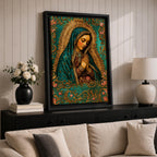 A vintage-style framed canvas depicting Our Lady of Guadalupe with her hands clasped in prayer, wearing a teal mantle adorned with stars and a golden halo radiating behind her. The artwork features intricate floral patterns surrounding the figure, emphasizing traditional Mexican Catholic iconography.