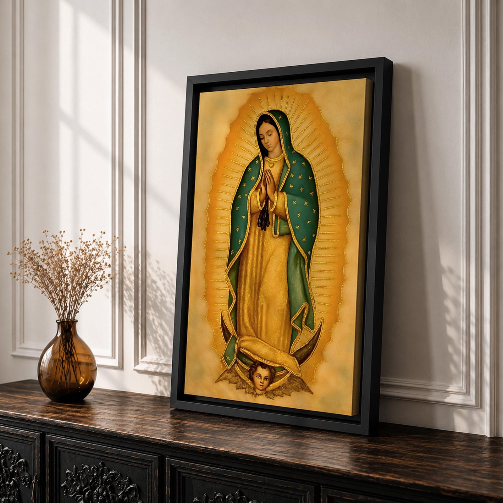 An illustration of Our Lady of Guadalupe standing in prayer with hands clasped, wearing a rose pink gown and a teal mantle filled with gold stars, surrounded by radiant golden sun rays and supported by a crescent moon with an angel beneath, rendered in traditional Mexican Catholic devotional style with rich warm tones and sacred symbolism.