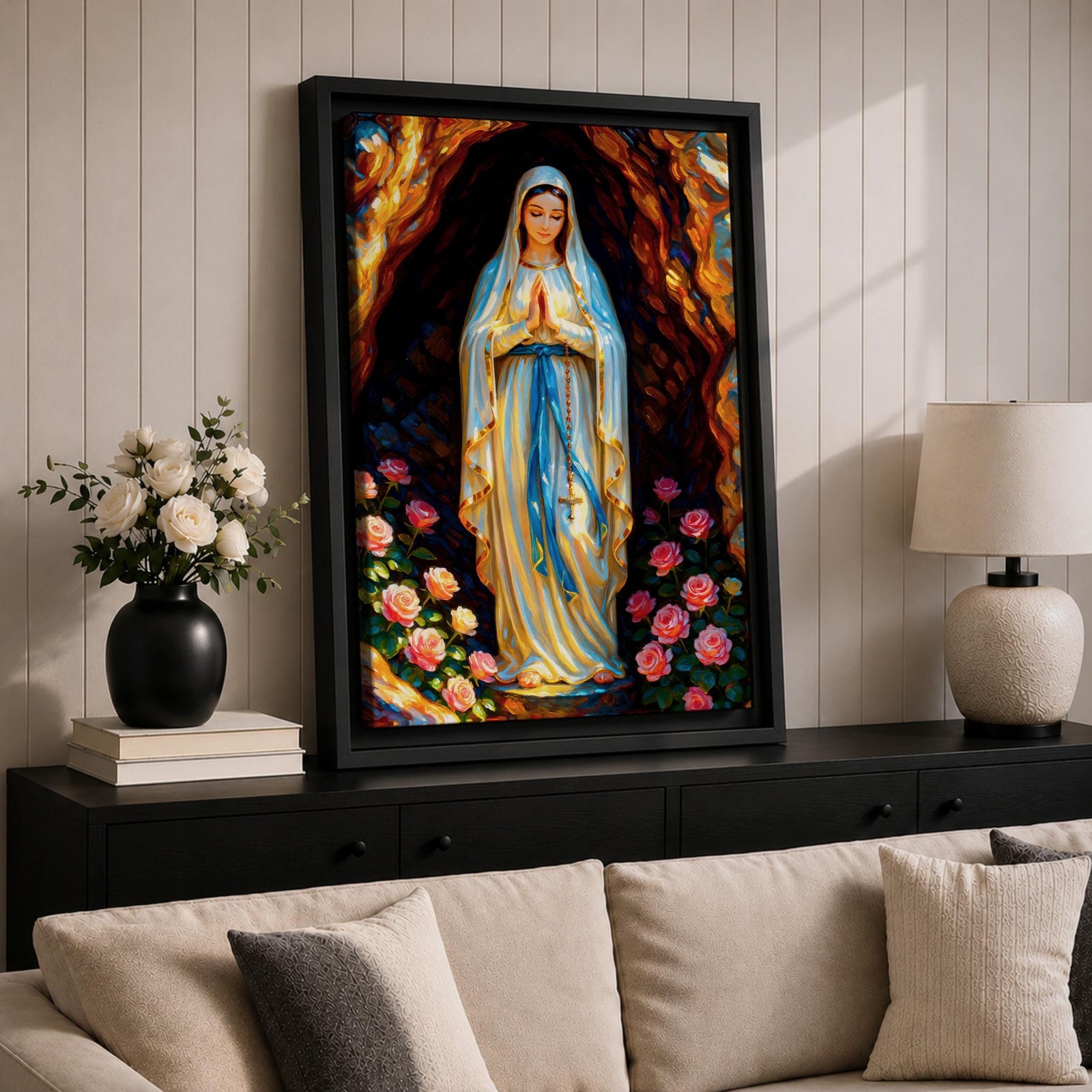 A devotional illustration of Our Lady of Lourdes standing in prayer with hands clasped, dressed in a flowing white robe with a pale blue sash and veil, appearing within a rocky grotto with soft radiant light, accompanied by delicate roses near her feet, rendered in traditional Catholic devotional style with gentle colors and serene composition.