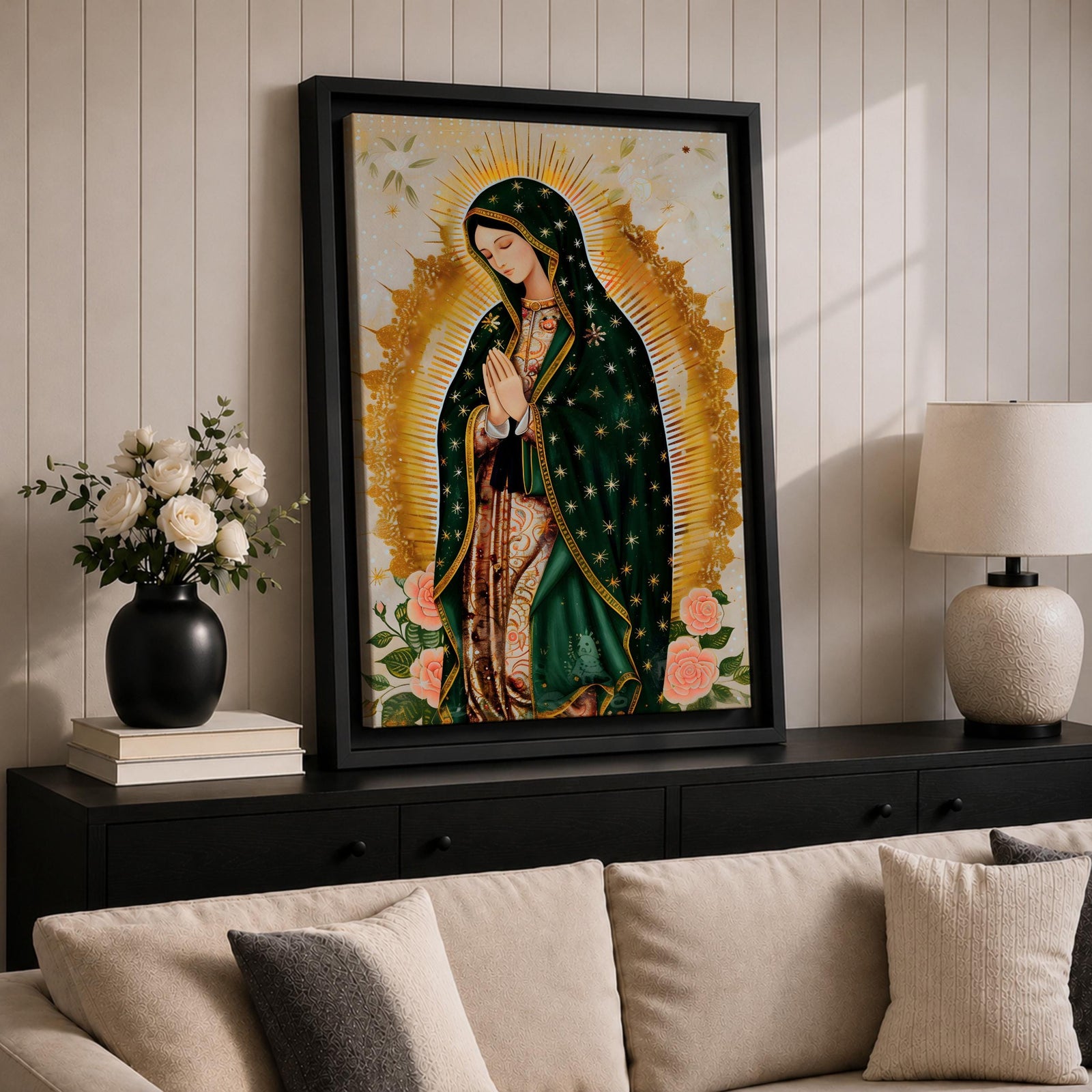 A devotional depiction of the Virgen de Guadalupe standing in prayer with hands clasped, wearing a rose pink gown and a teal mantle covered with gold stars, surrounded by radiant golden sun rays and standing above a crescent moon with a small angel beneath, rendered in a modern Mexican Catholic style with vibrant colors and sacred symbolism.